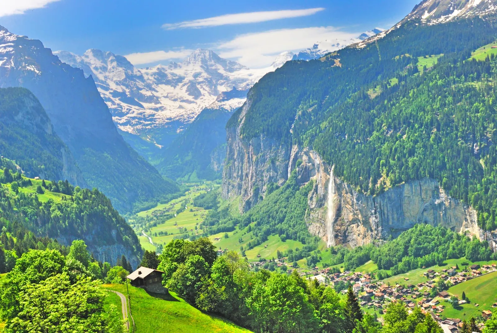 Dark thunderstorm clouds building over an exposed alpine ridge trail in Switzerland