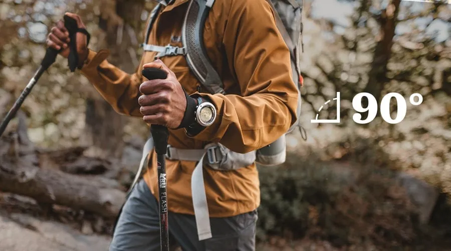 Hiking poles being measured for length on a table at home