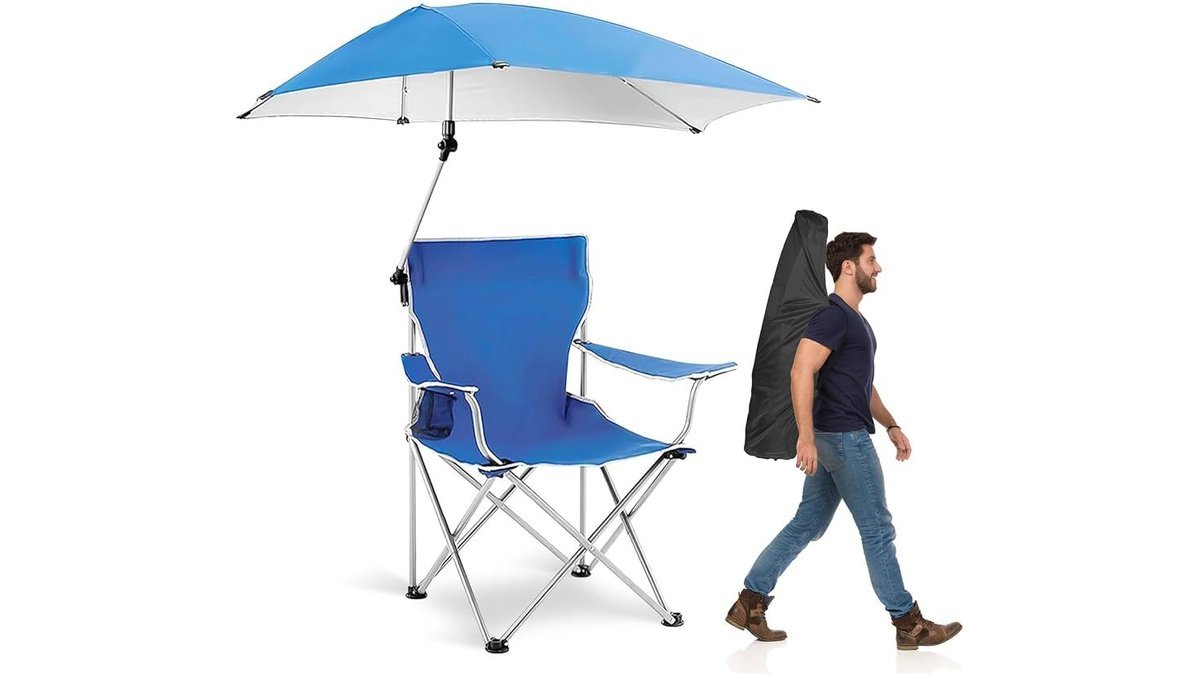 A sturdy camping chair for fishing sits on a quiet riverbank at sunrise.